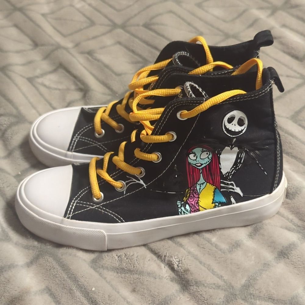 This is a pair of Disney "The Nightmare Before Christmas" high-top sneakers
